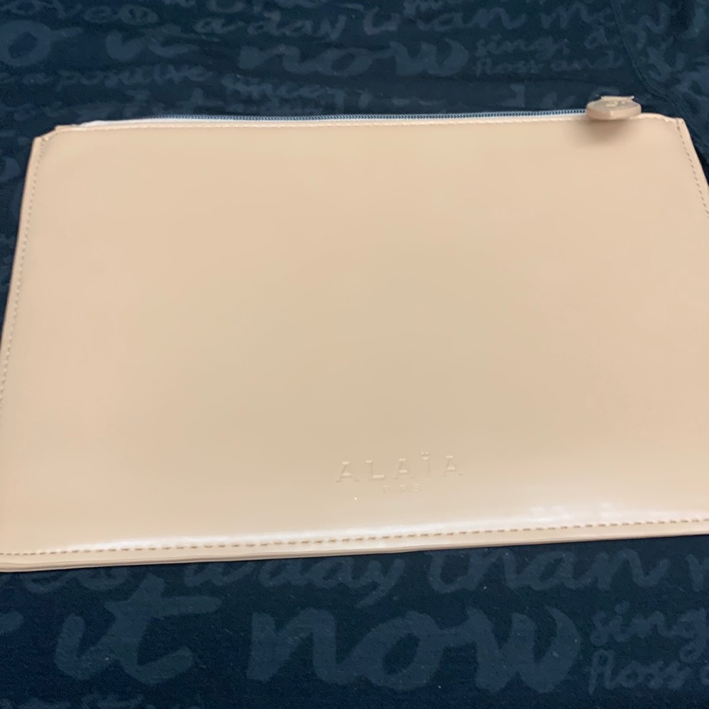 Alaia nude clutch bag